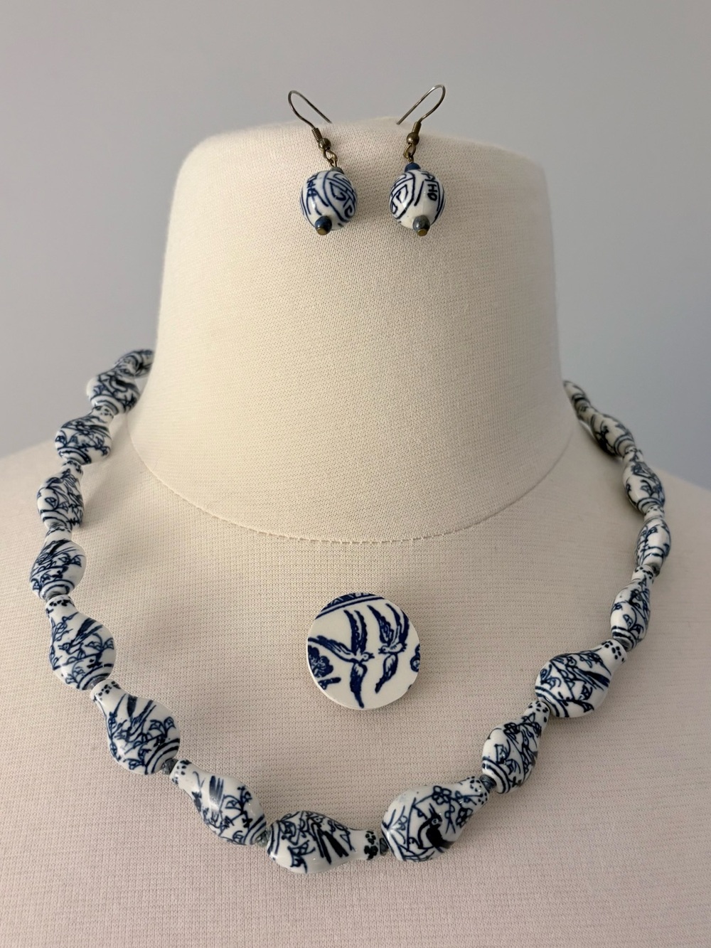 Set of Chinese blue and white ceramic jewelry: necklace, brooch, and earrings